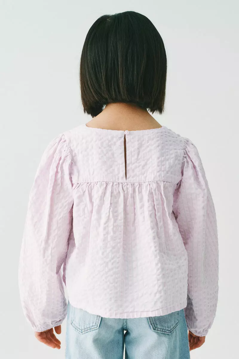 Bow-detail cotton seersucker blouse