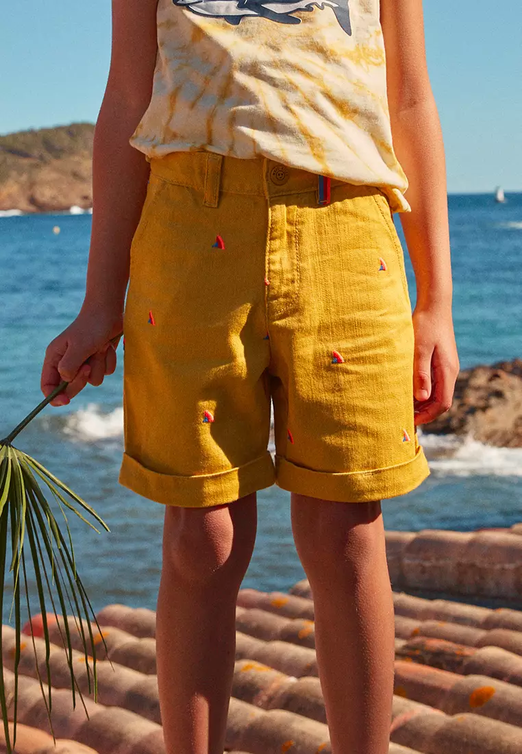 MUSTARD SHORTS WITH MULTICOLOURED SHARK FIN EMBROIDERIES