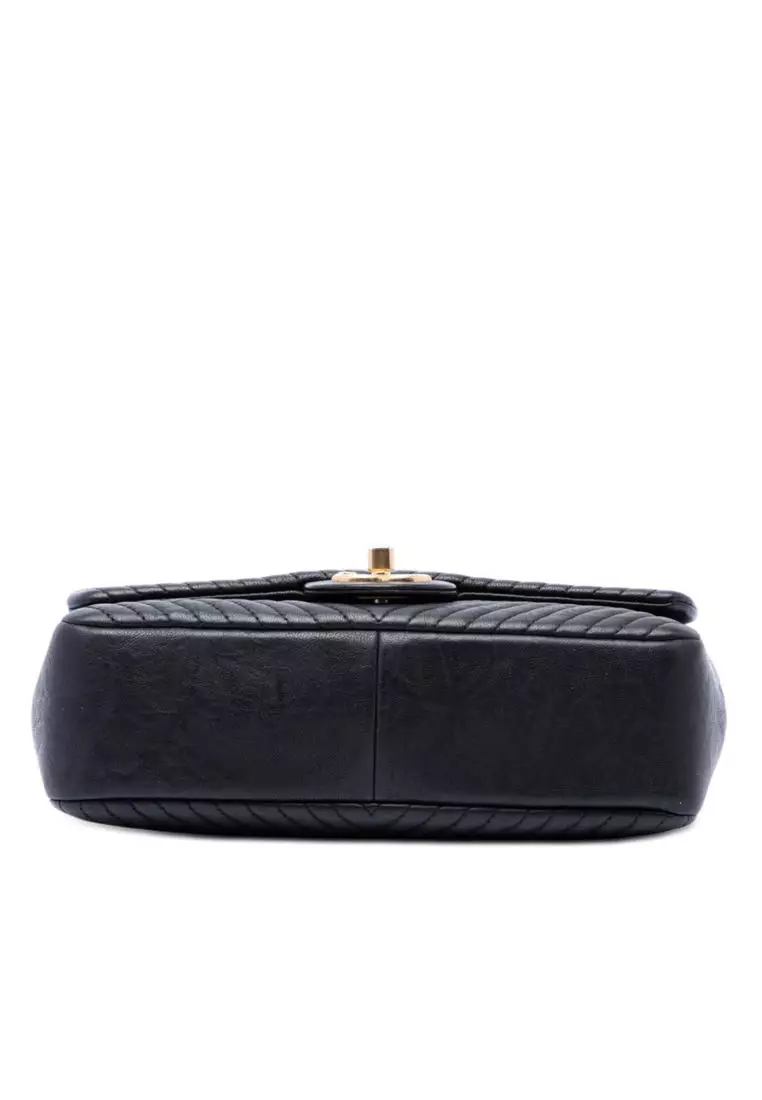 Pre-Loved Chanel Small Chevron Wrinkled Calfskin Medallion Charm Surpique Flap