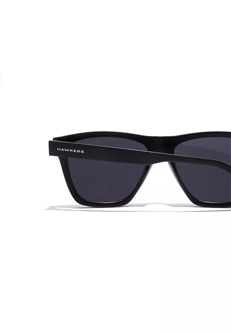 HAWKERS Black Dark ONE LS RAW. Sunglasses for Men and Women, Unisex. UV400 protection. Official product designed and made in Spain