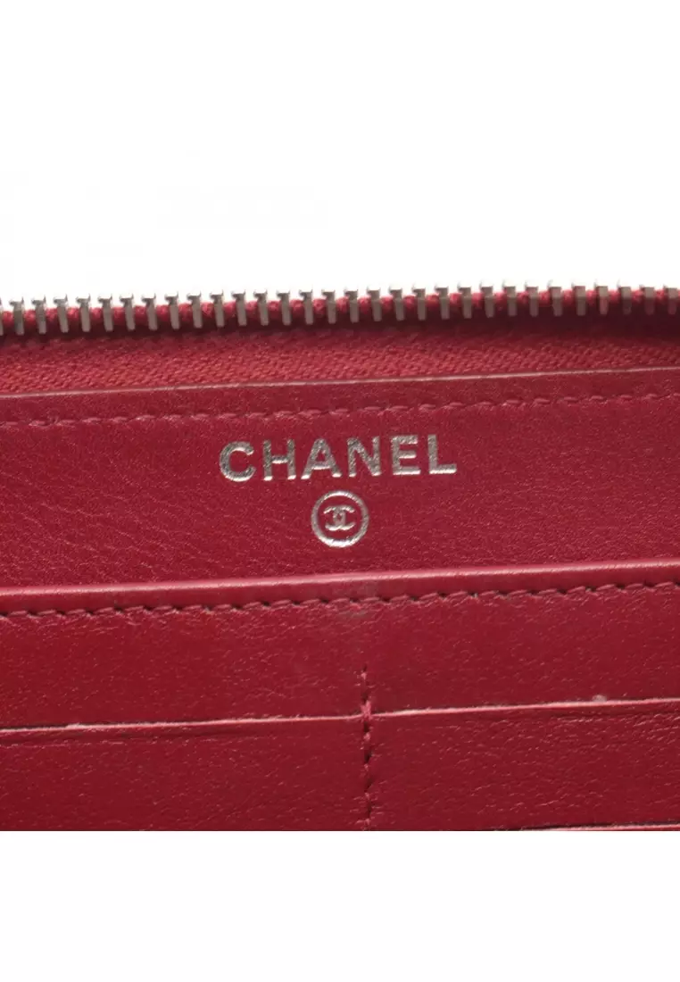 Pre-Loved Chanel round zipper long wallet Caviar skin Red silver hardware