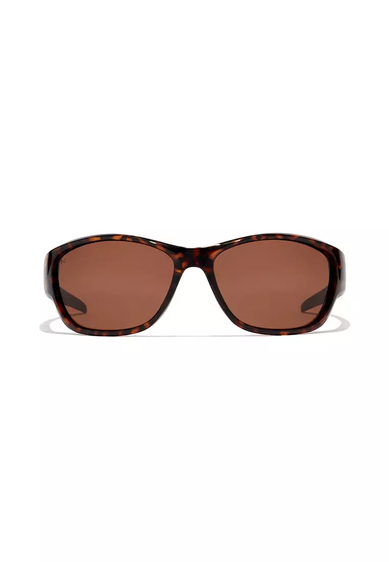 HAWKERS POLARIZED Carey Brown RAVE Sunglasses for Men and Women, Unisex. UV400 Protection. Official Product designed in Spain
