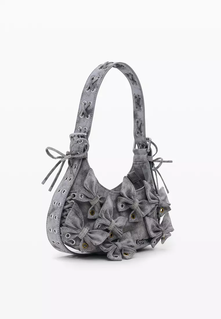 Handbag with small butterfly decoration