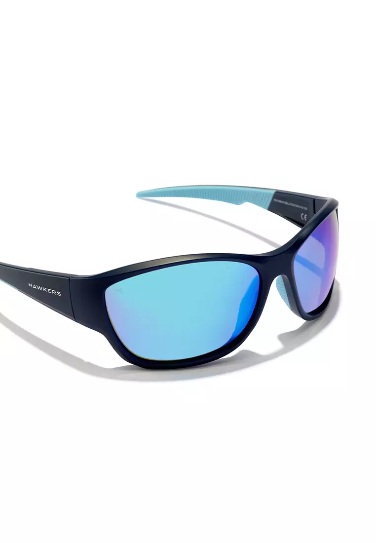 HAWKERS Navy Clear Blue RAVE Sunglasses for Men and Women, Unisex. UV400 Protection. Official Product designed in Spain