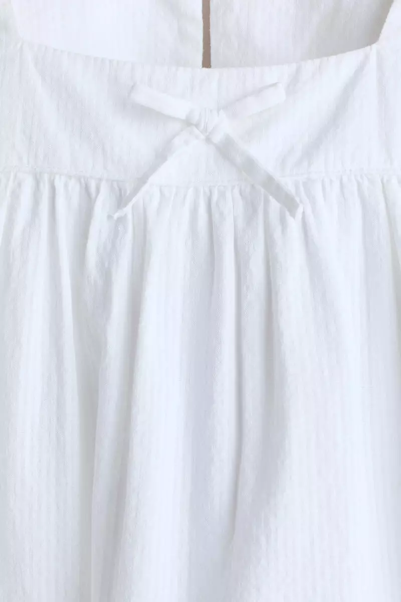 Bow-detail cotton seersucker blouse