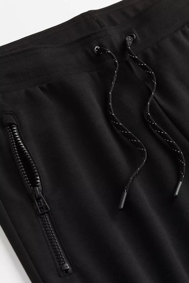 DryMove™ Tapered tech joggers with zipped pockets