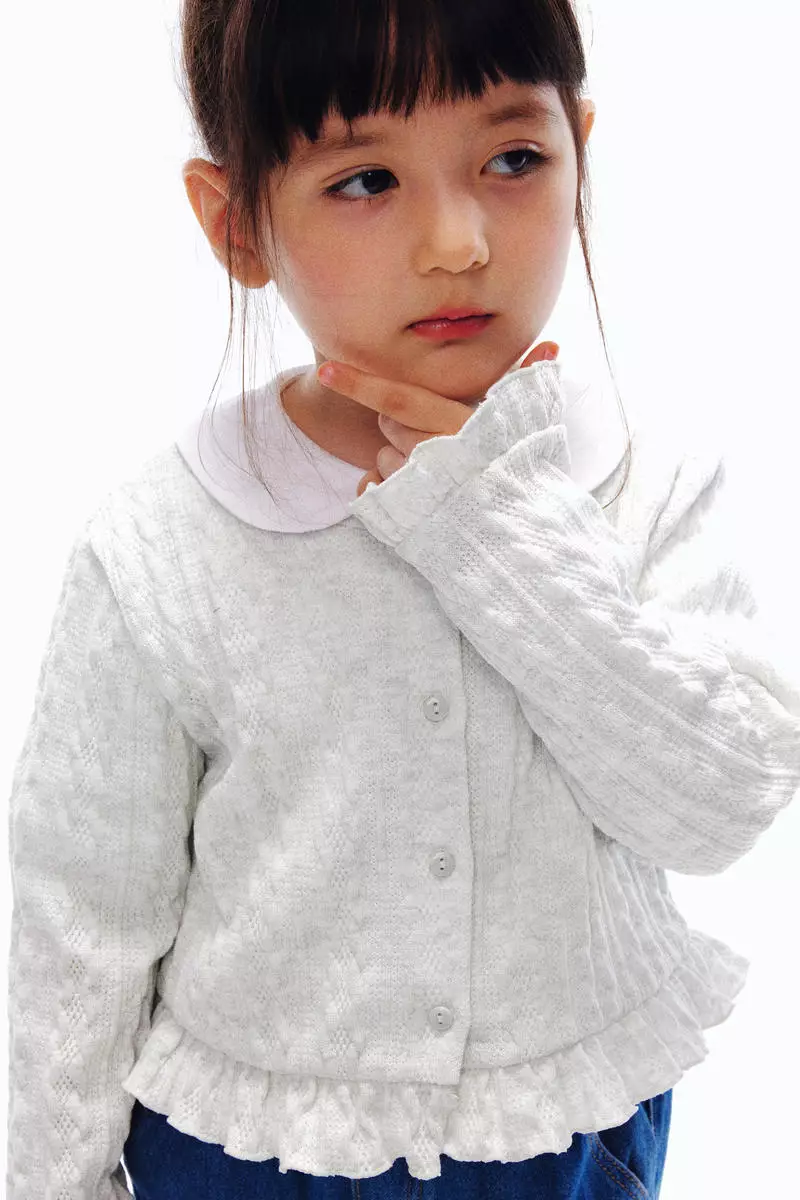 Cable-knit frill-trimmed cardigan