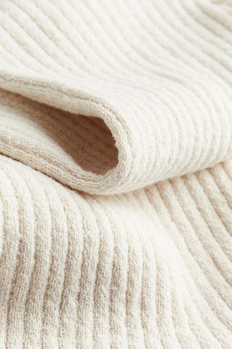 Flared rib-knit trousers