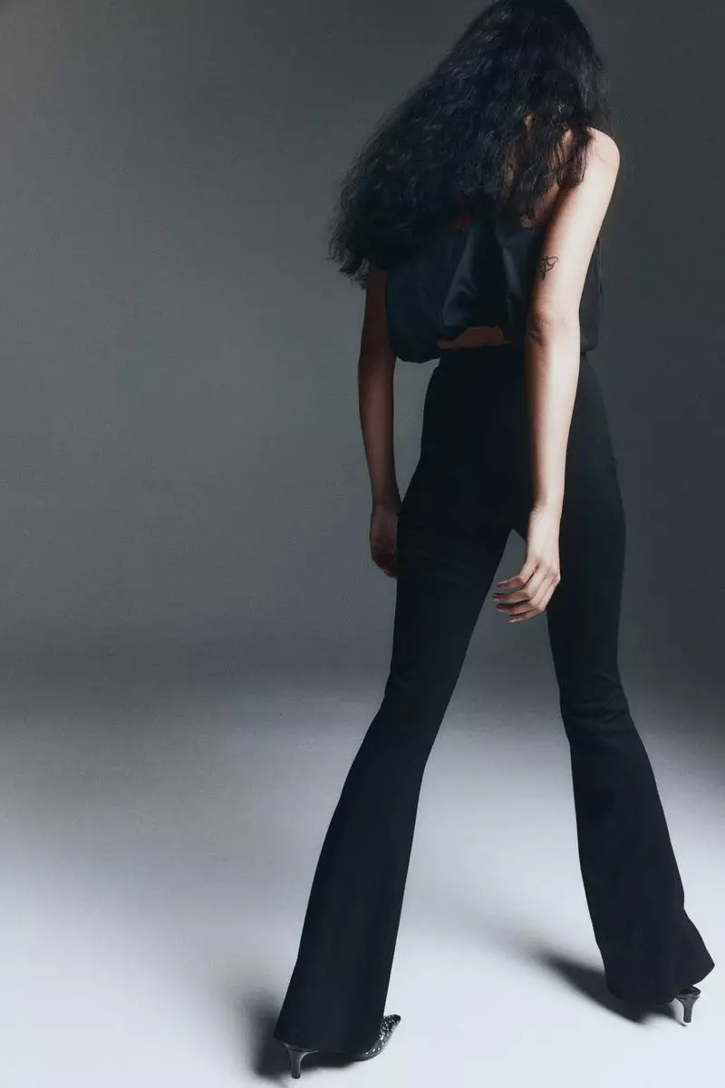 Flared belt-detail trousers