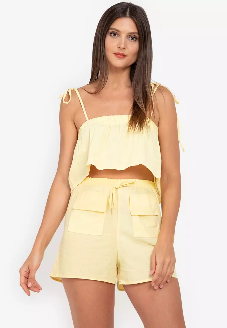 NOHEMI Ruffled Sleeveless Trapeze Top