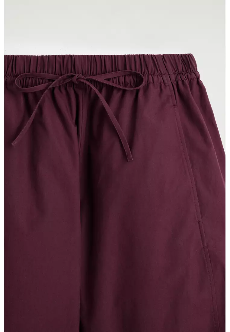 ELASTICATED BARREL-LEG TROUSERS