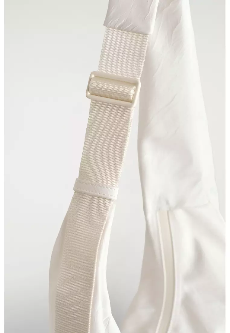 CURVED CROSSBODY BAG - CRINKLED-SHELL
