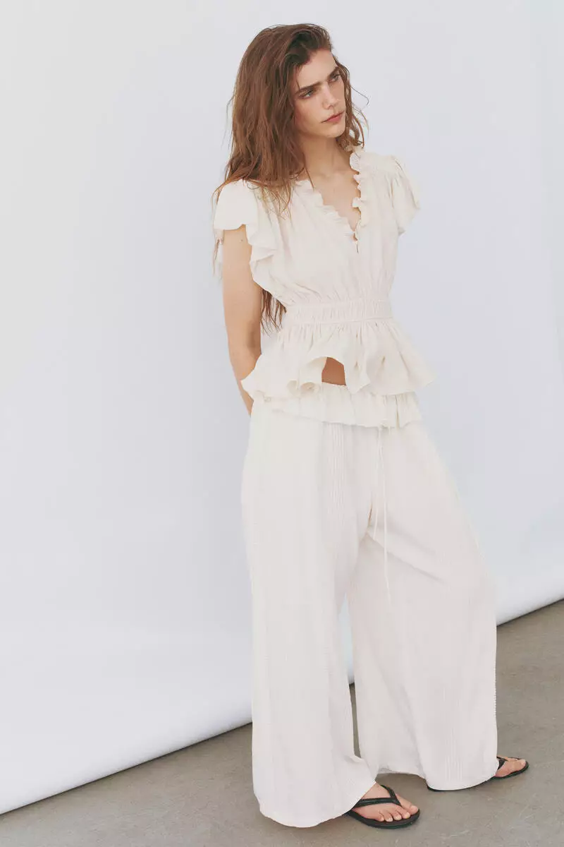Flutter-sleeved peplum blouse