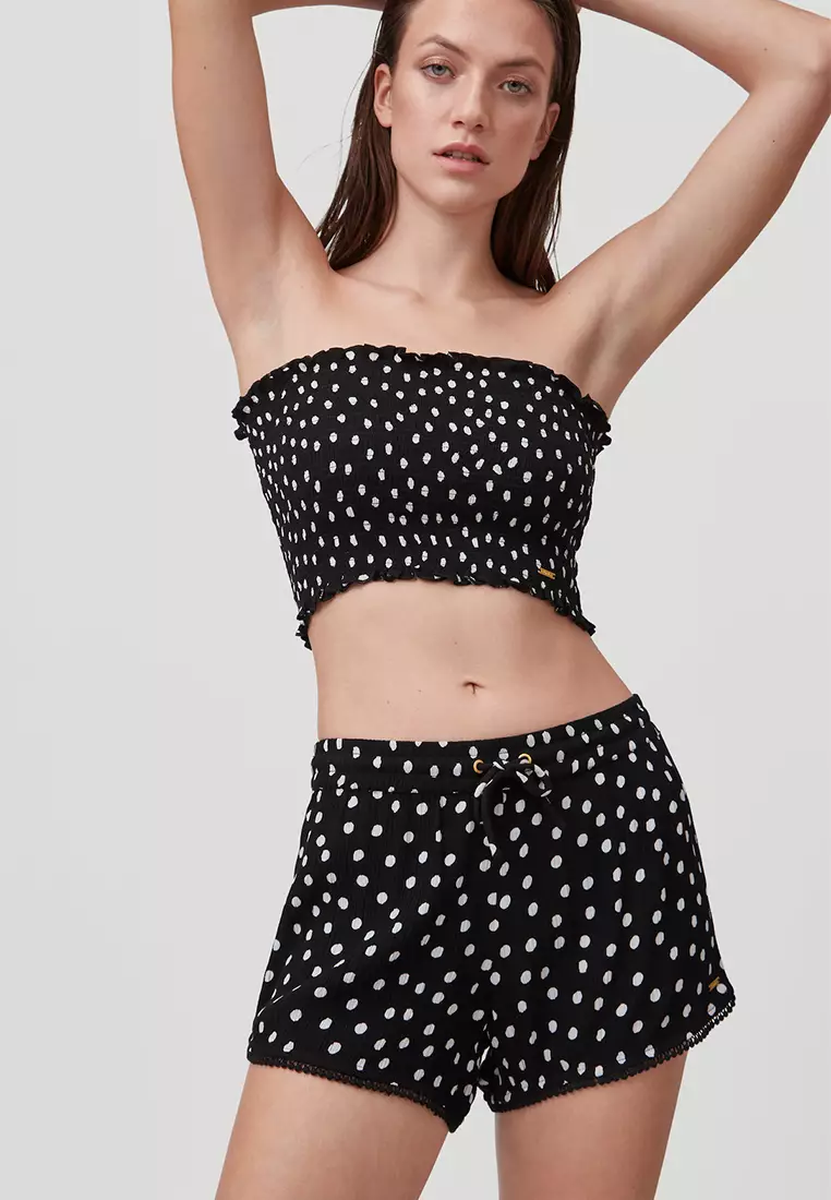 White shorts with cheap black polka dots