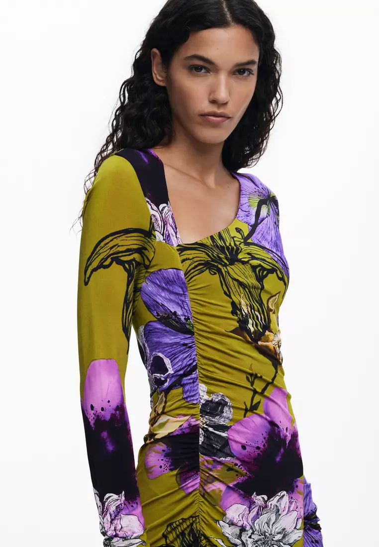 Asymmetric neckline dress designed by Mr. Christian Lacroix