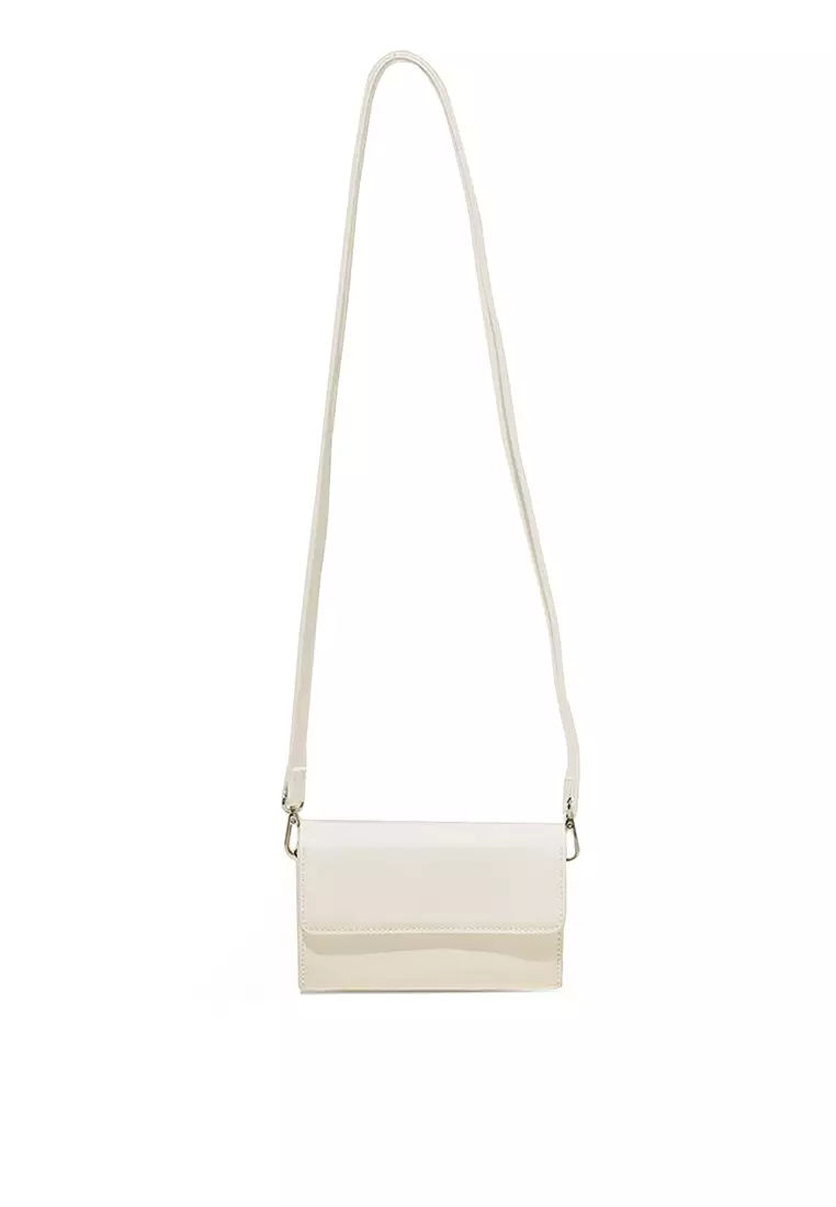 White clearance patent handbag