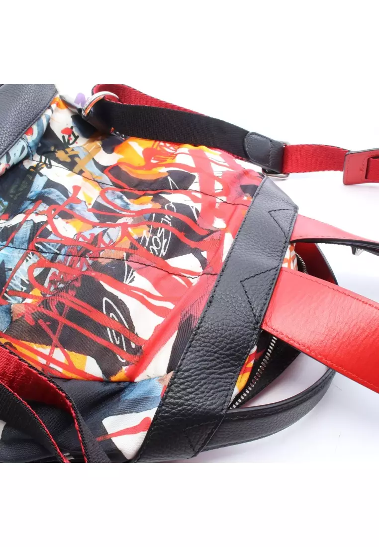 Pre-Loved CHRISTIAN LOUBOUTIN BACKLOUBI SMALL Backpack rucksack Nylon leather rubber black Red multicolor