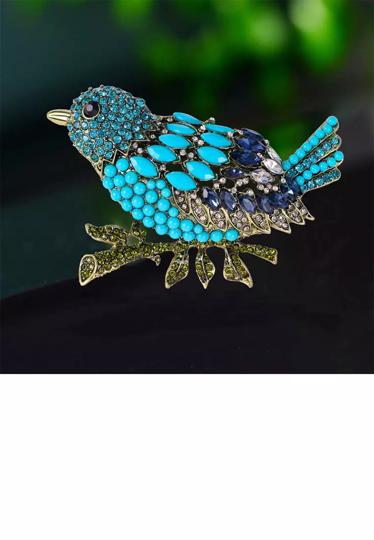 Gold bird clearance brooch