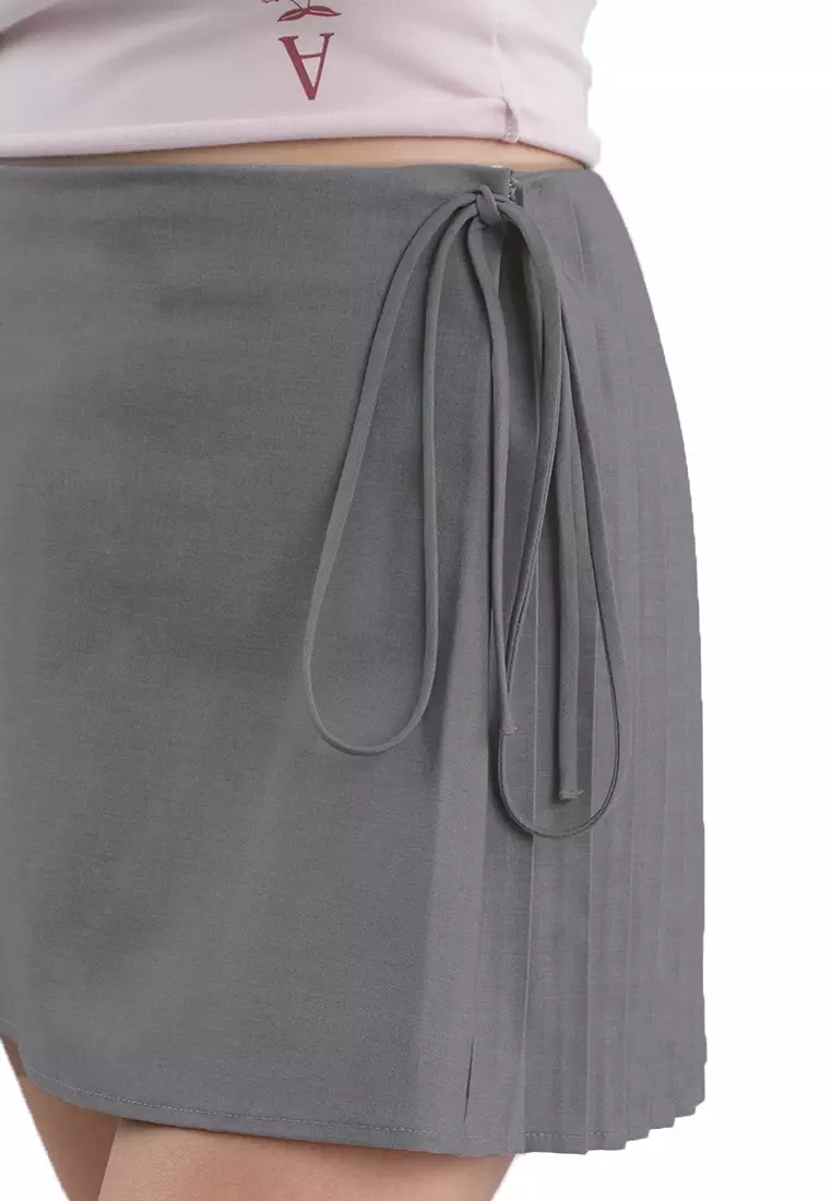 Mini Skirt With Side Pleats And Tie Detail