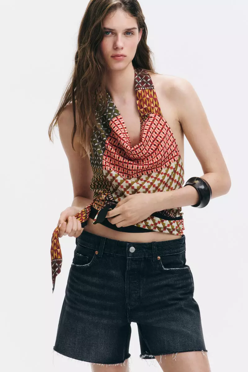 Raw-edge denim shorts