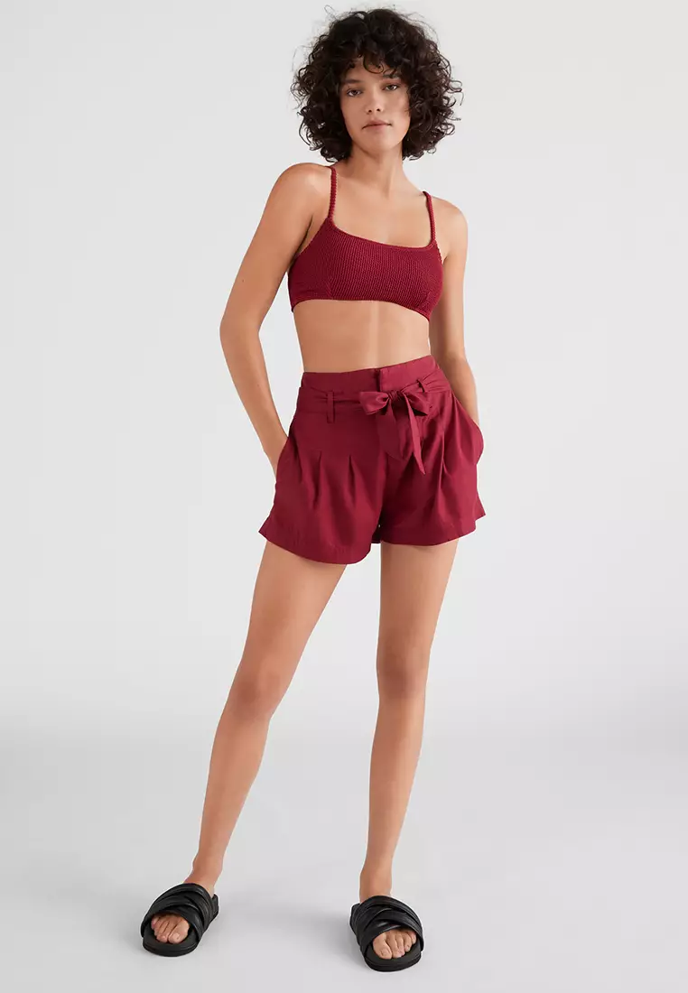 Red best sale belted shorts