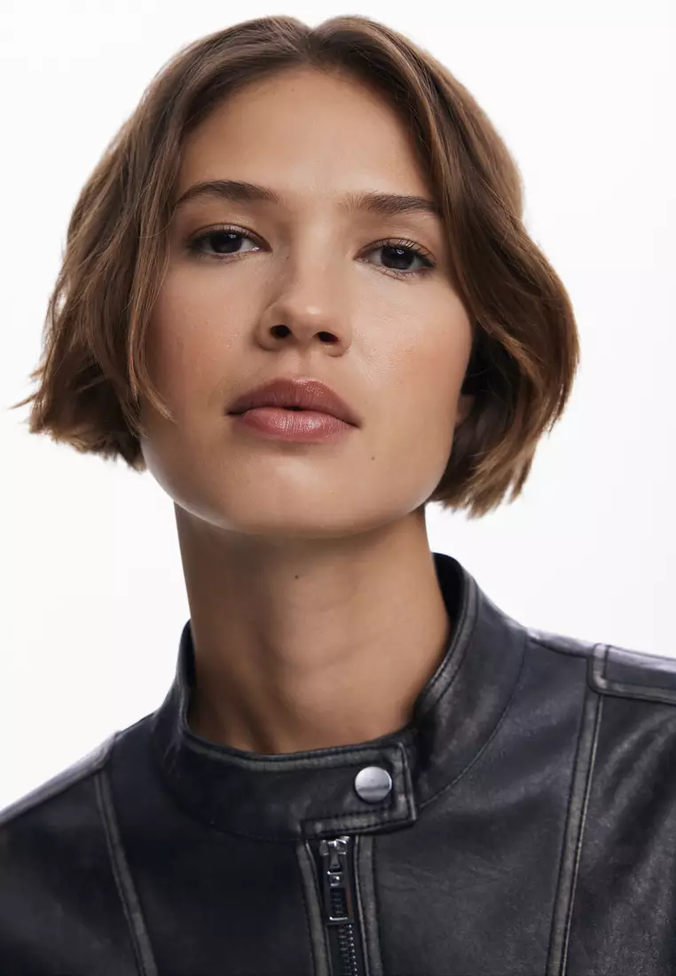 Jacket with worn leather effect