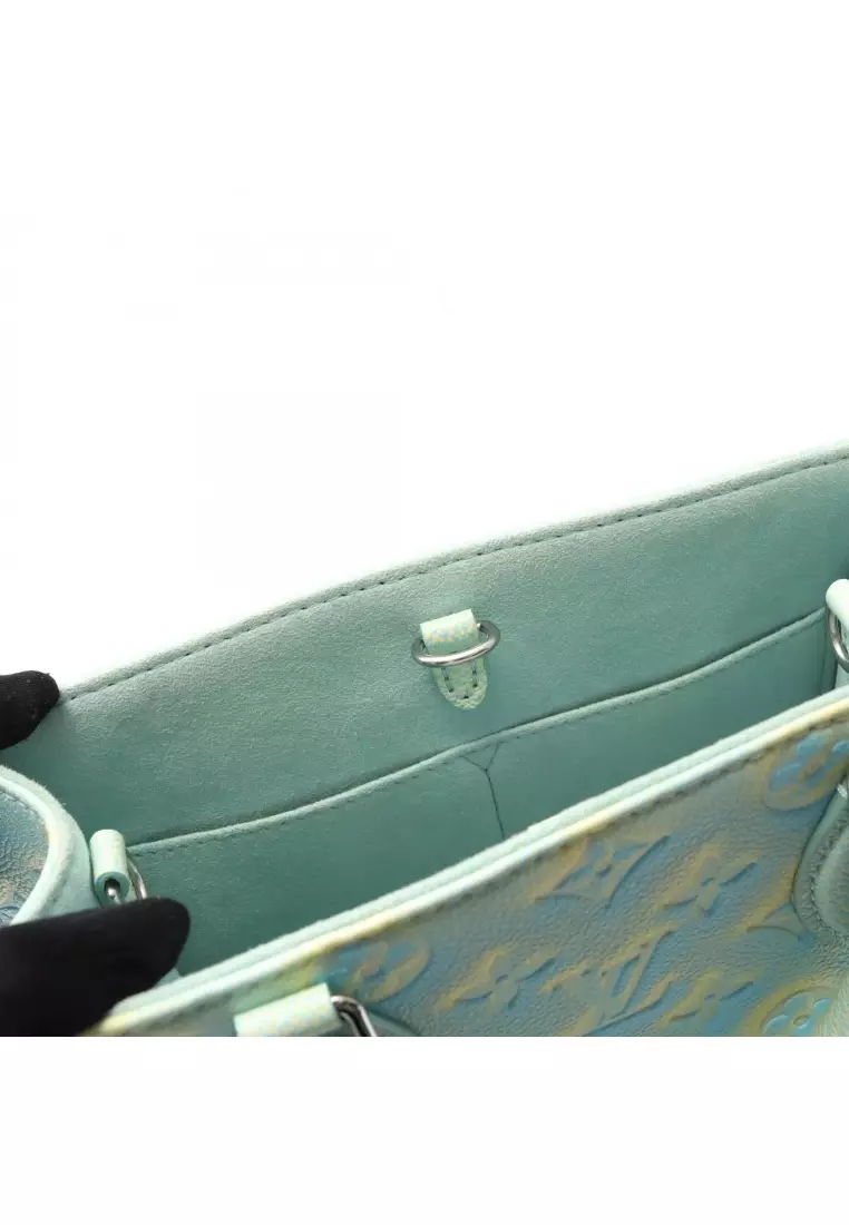 Pre-Loved Louis Vuitton On-the-Go PM Monogram Empreinte Handbag leather Light blue Light yellow 2WAY