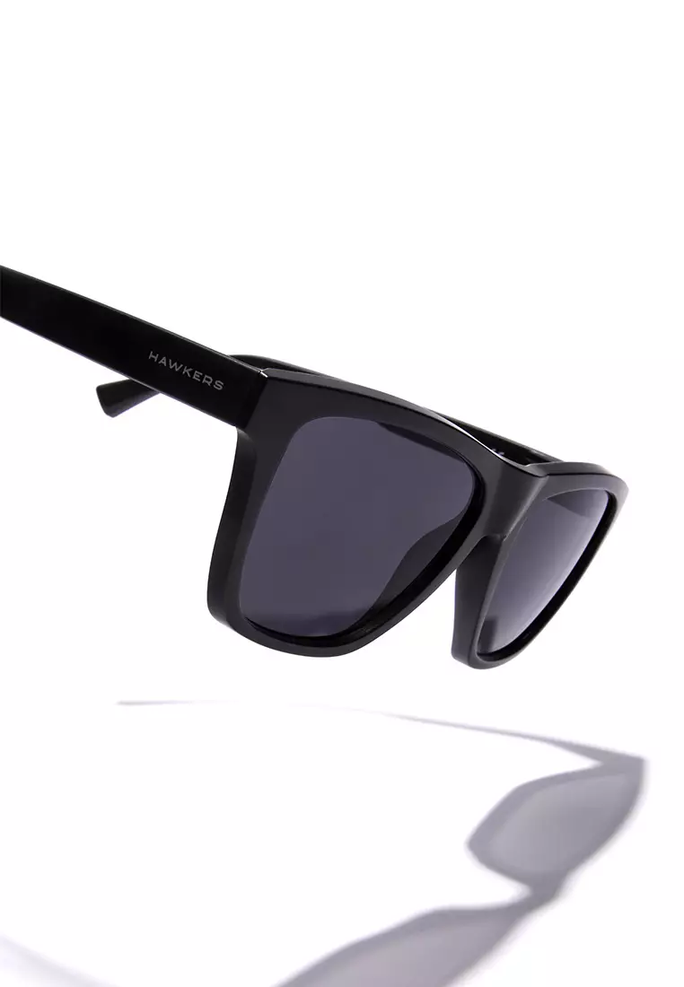 HAWKERS Black Dark ONE LS RAW. Sunglasses for Men and Women, Unisex. UV400 protection. Official product designed and made in Spain