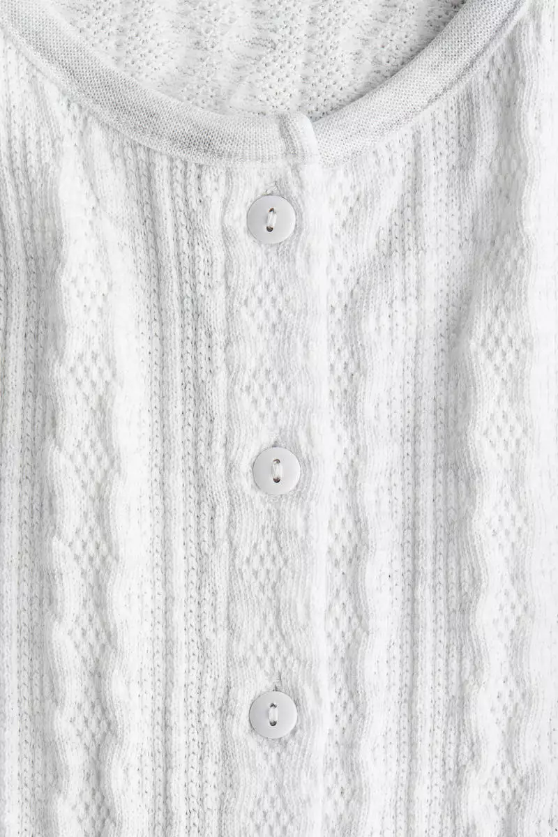 Cable-knit frill-trimmed cardigan
