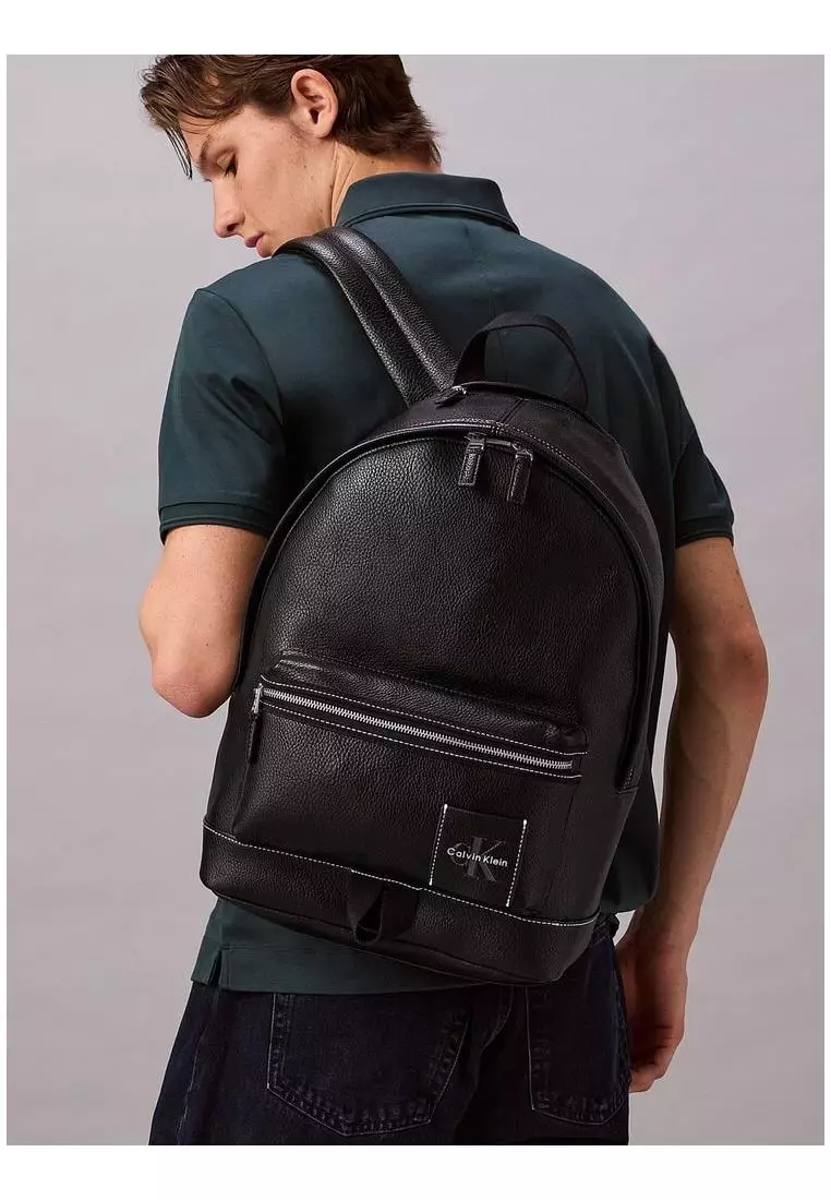 calvin klein pebble leather backpack Black Grain This versatile backpack offers ample storage for your essentials Men's Calvin Klein Leather Backpacks