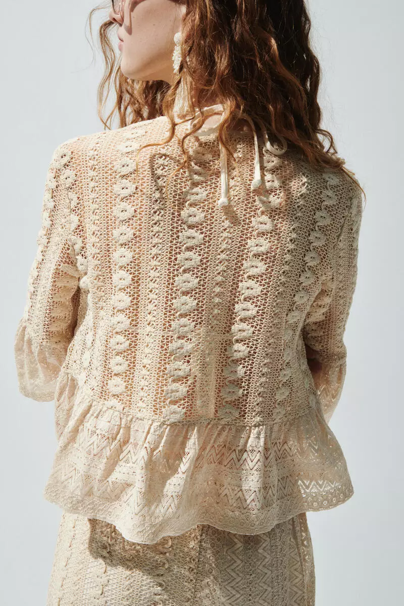 Frill-trimmed lace blouse