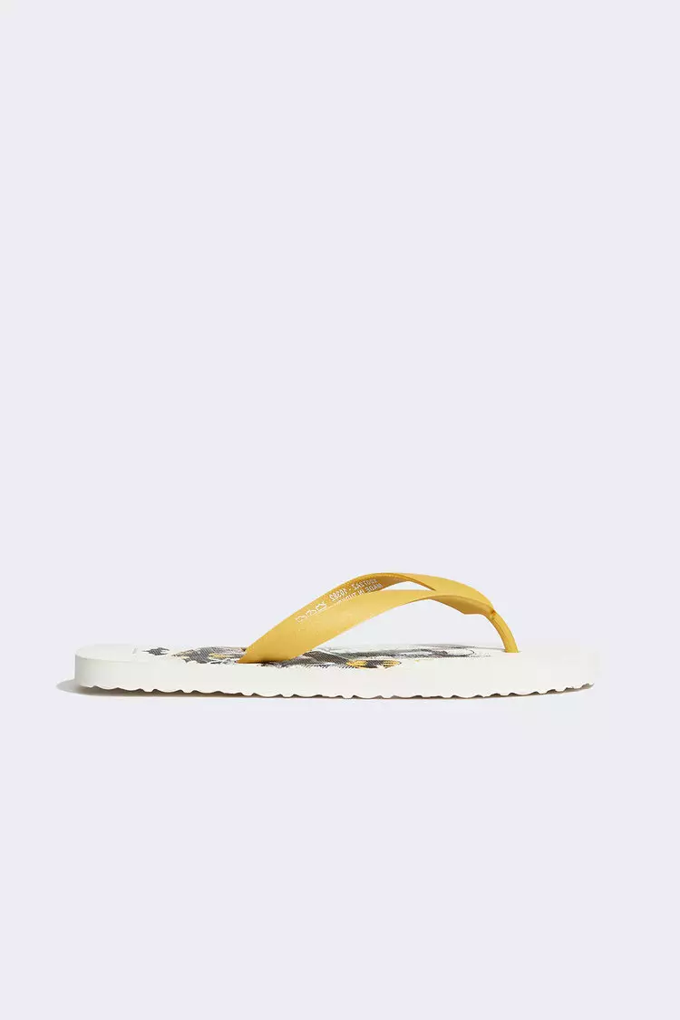 Gold and store white flip flops