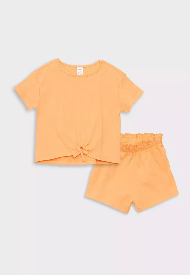 Girl in t hot sale shirt and shorts
