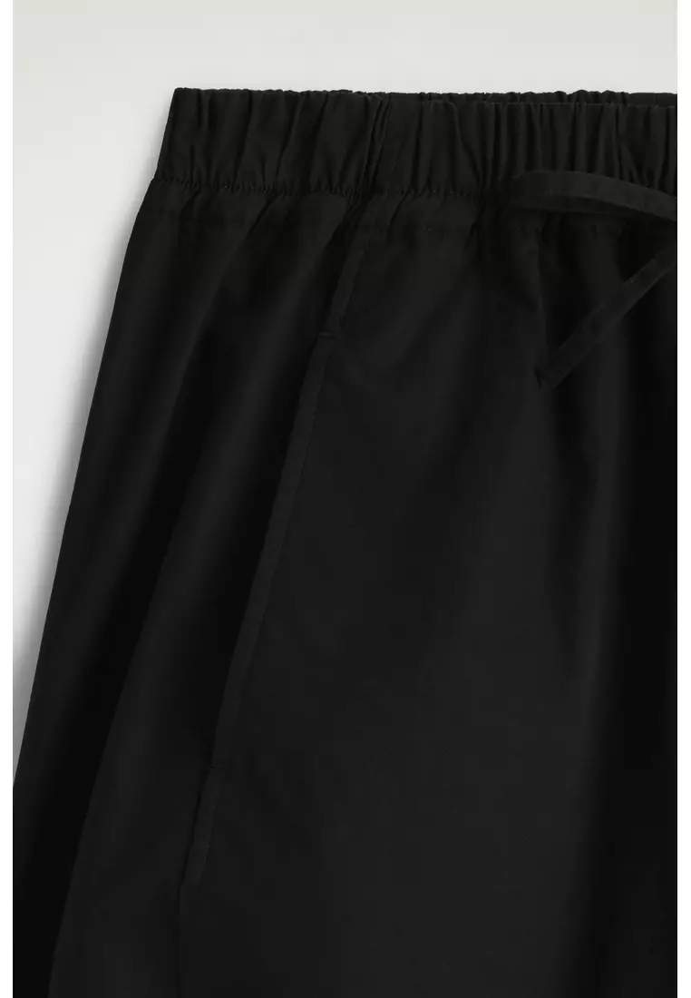 ELASTICATED BARREL-LEG TROUSERS