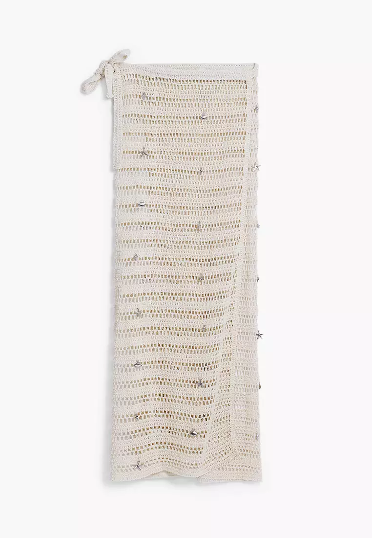 Eyelet wrap dress with appliqués