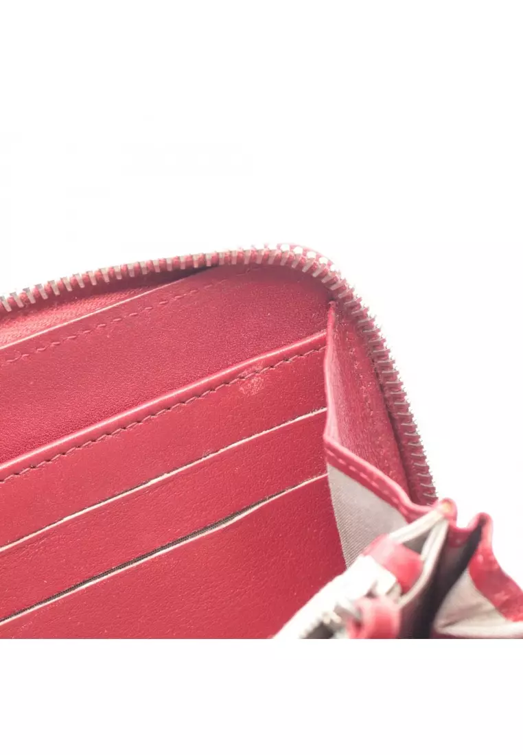 Pre-Loved Chanel round zipper long wallet Caviar skin Red silver hardware
