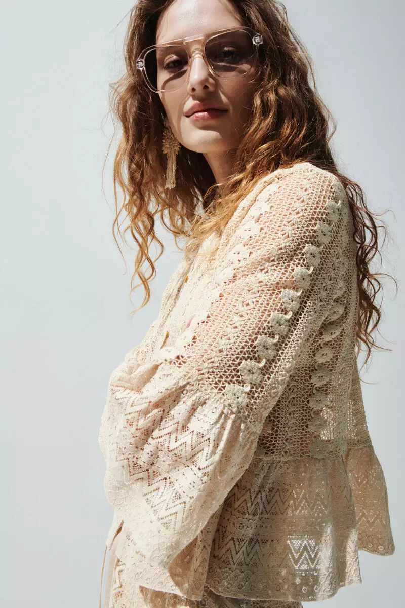 Frill-trimmed lace blouse