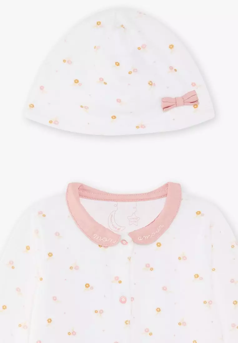 Off white sleepsuit and floral print beanie