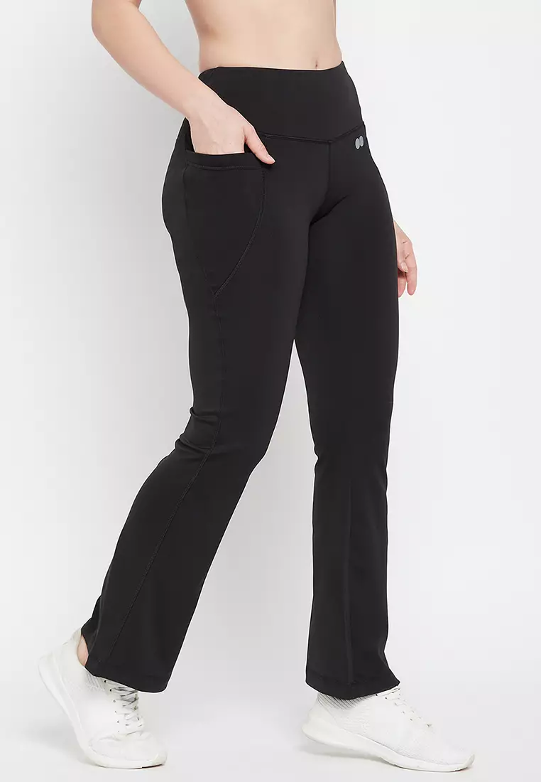 Clovia High Waist Flared Yoga Pants in Black with Side Pockets
