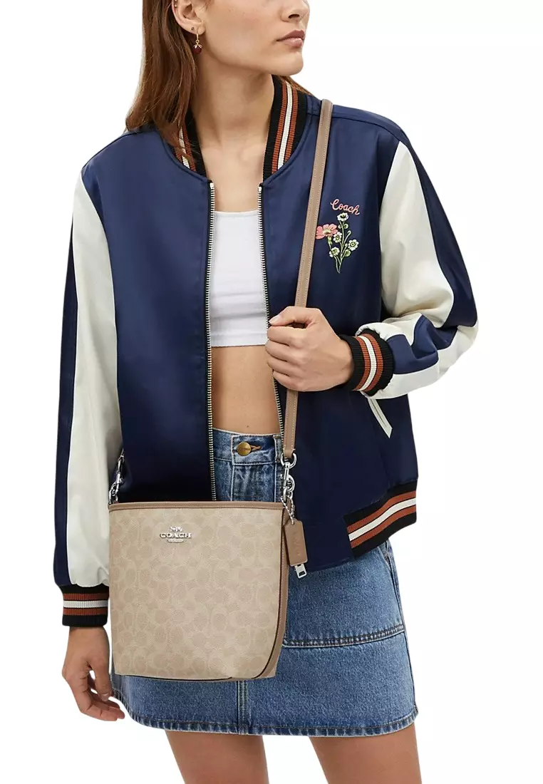 City Bucket Bag In Signature Canvas - Sand Beige