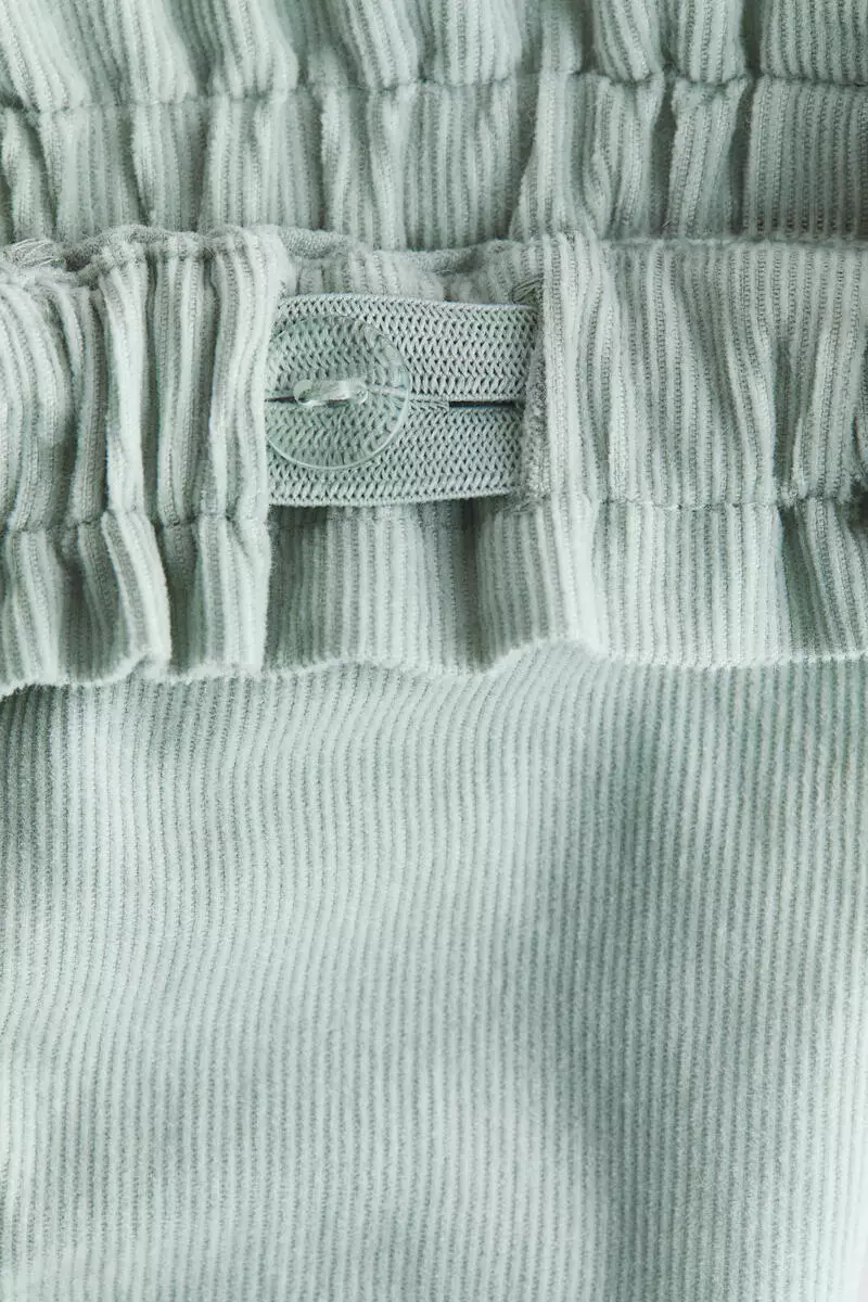 Frill-trimmed corduroy trousers