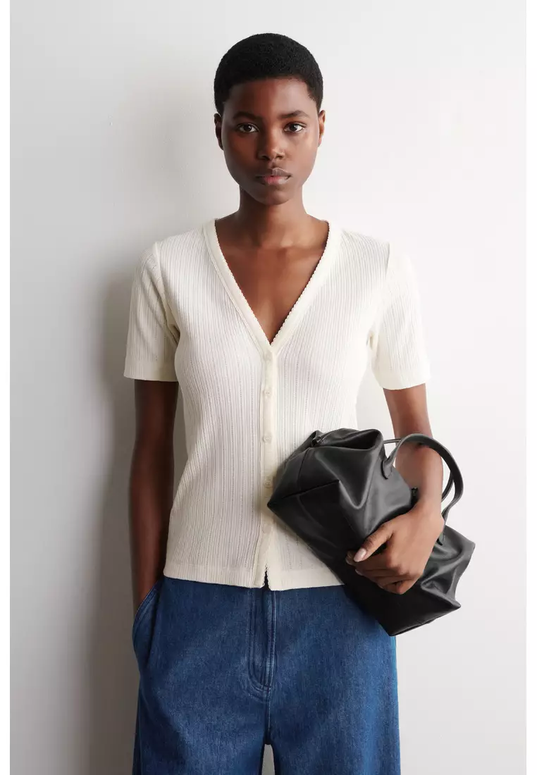 Buy COS POINTELLE-KNIT SHORT-SLEEVED CARDIGAN 2026 Online | ZALORA