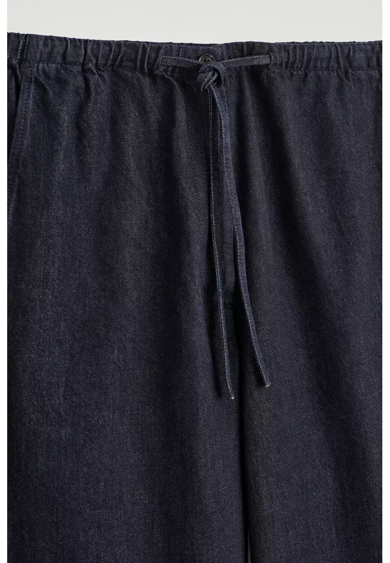 Buy COS DRAWSTRING DENIM TROUSERS 2026 Online | ZALORA