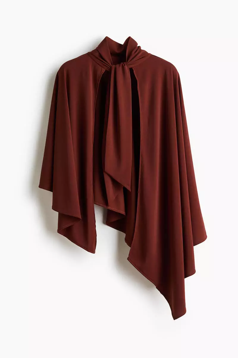 Asymmetric cape top