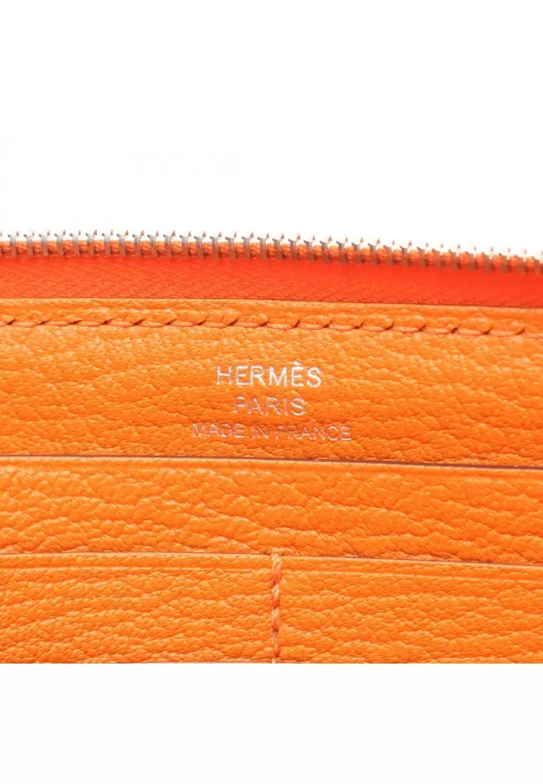 Pre-Loved Hermès Azap Long silk in Feu round zipper long wallet Chevre orange silver hardware □P stamp