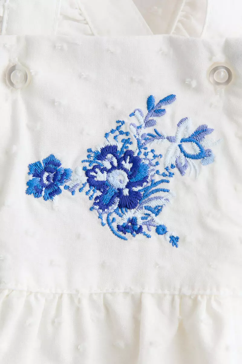 Frill-trimmed cotton romper suit