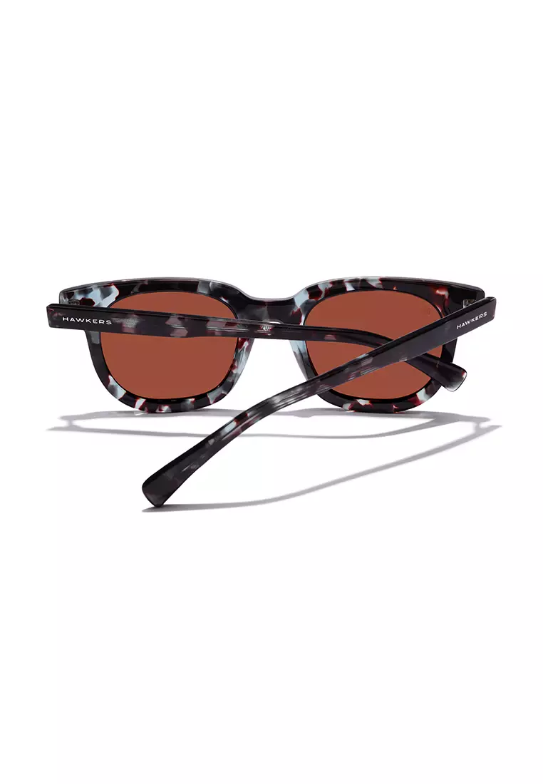 HAWKERS Blue Carey Brown Oasis Sunglasses For Men And Women, Unisex. Official Product Designed In Spain