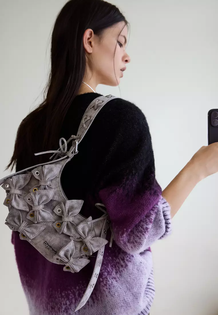 Handbag with small butterfly decoration