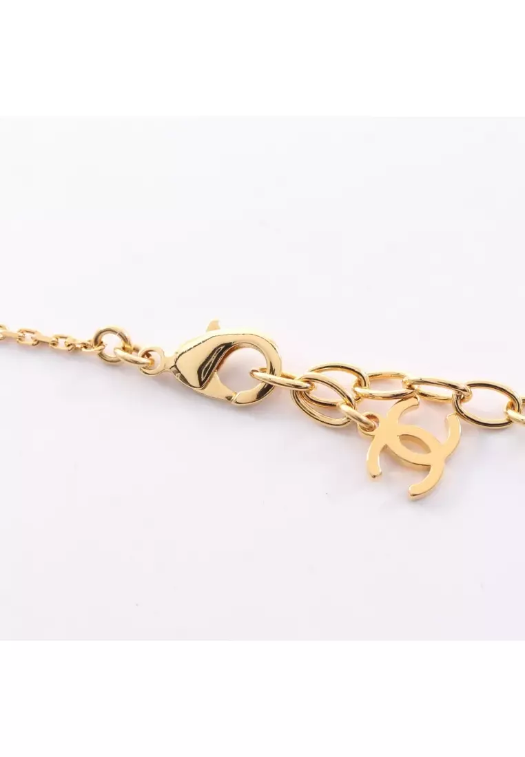 Pre-Loved Chanel coco mark horse riding necklace GP gold white black L26P