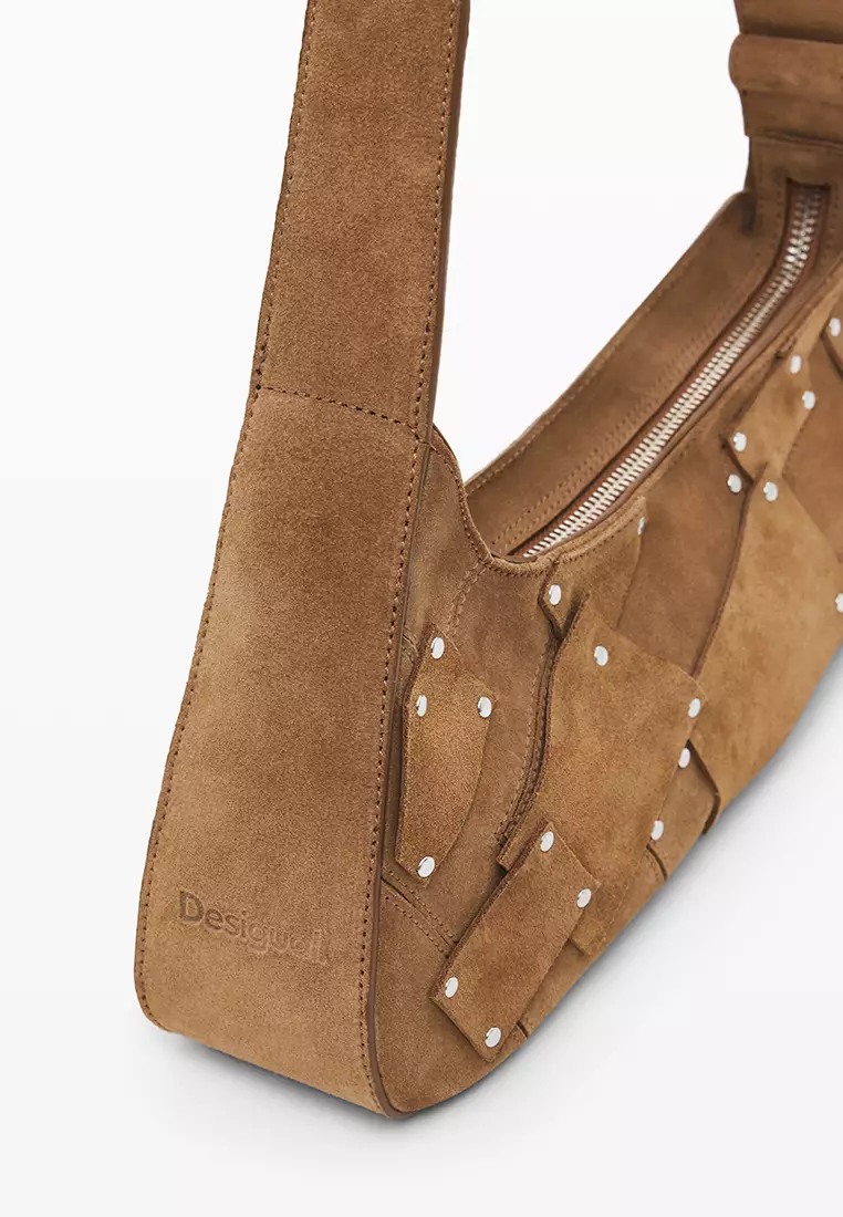 100% leather bag with small asymmetrical flap